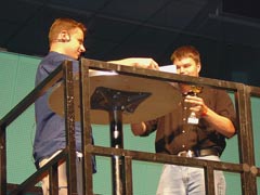 Ari 'Artz' Pulkkinen receiving his winning diploma from the event's main organizer Jussi 'Abyss' Laakkonen.